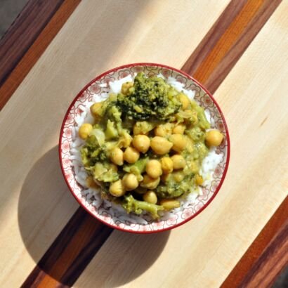 curry broccoli chickpeas rice cutting board