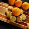 orange-oatmeal cookies on walnut bread board