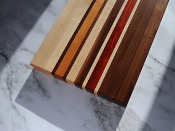 Edge grain cutting board made from walnut, maple, cherry, and padauk