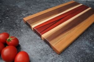 padauk cutting board by kinship crafts